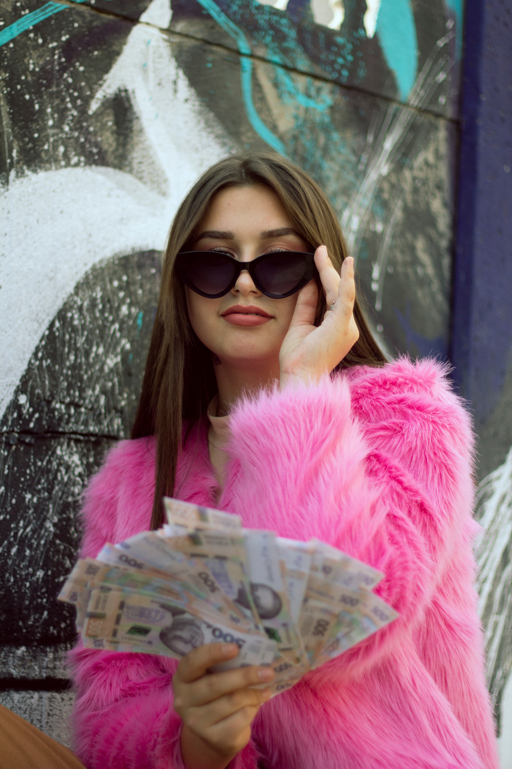 Woman in Pink Fur Coat Wearing Sunglasses